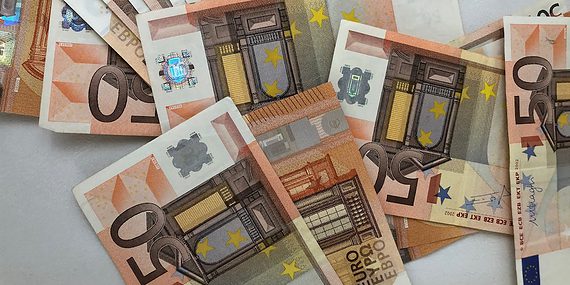 50 euro banknote lot on white surface