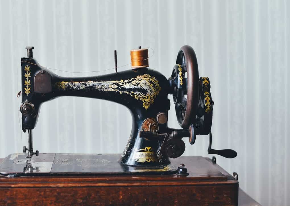 black and yellow metal sewing machine