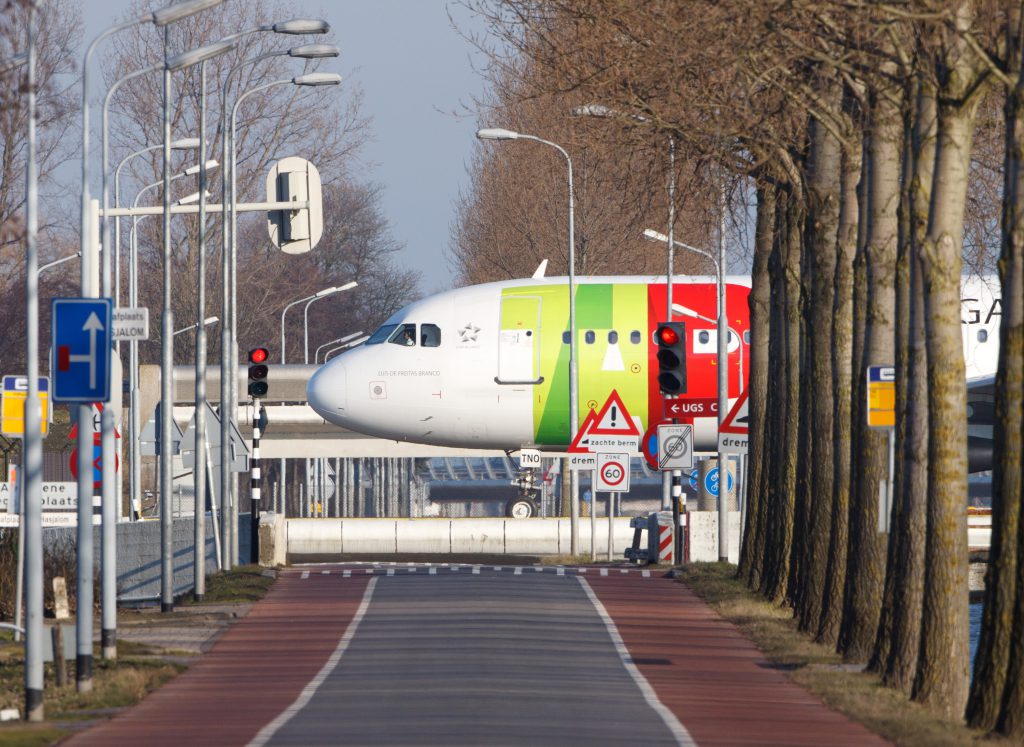 Airbus A320 TAP Portugal taxiing for take off to the Polderbaan runway 36L Schiphol Amsterdam Holland the Netherlands second. Canon 500mm