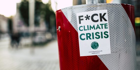 Sticker of climate crisis attached in metal