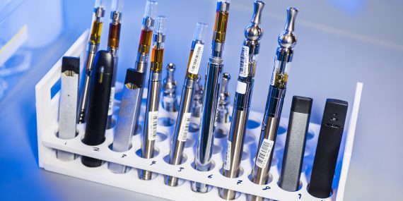 This image depicted a test tube rack that had been stocked with examples of various electronic cigarettes, referred to as e-cigarettes, or e-cigs, and vaping pens. These items would undergo testing inside a Centers for Disease Control and Prevention (CDC) laboratory environment.