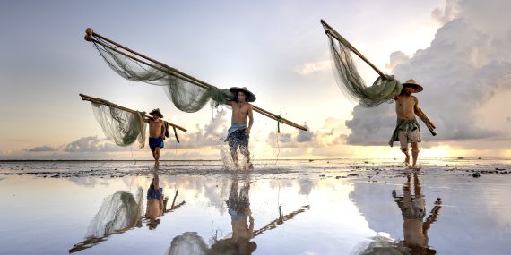 Fishermen carrying their fishnets