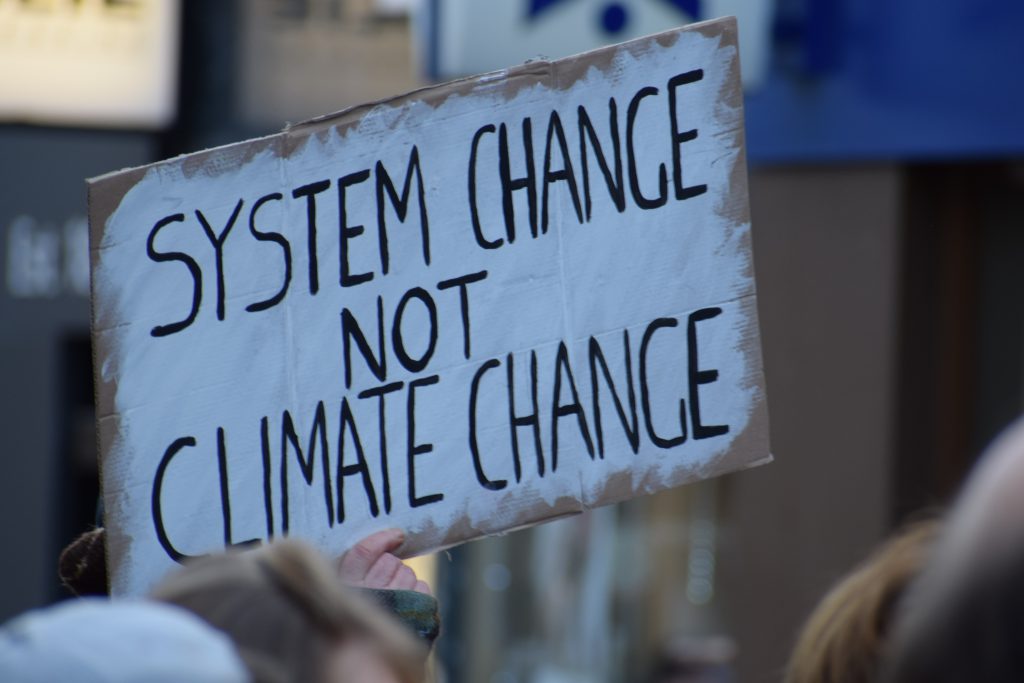 System change not Climate Change sign