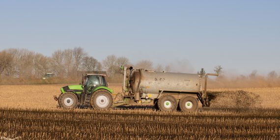 Tractor delivering slurry onto a field