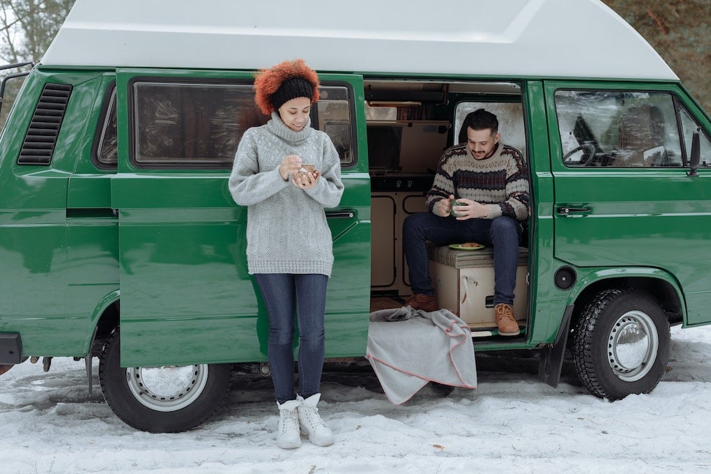 Couple Living in a Green Van in the Forest