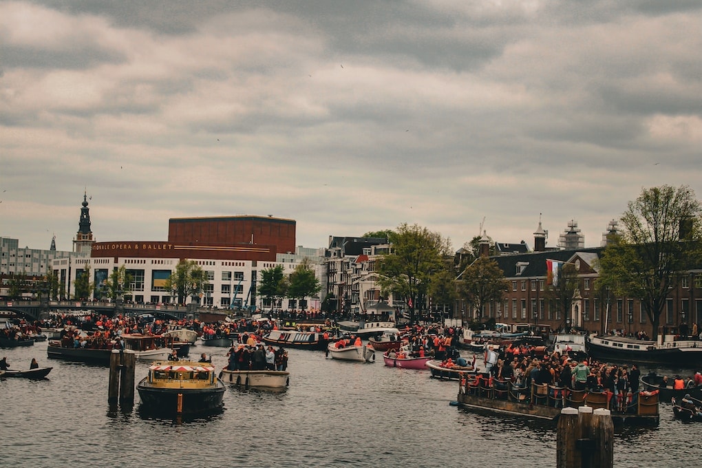 a body of water with boats in it and buildings around it