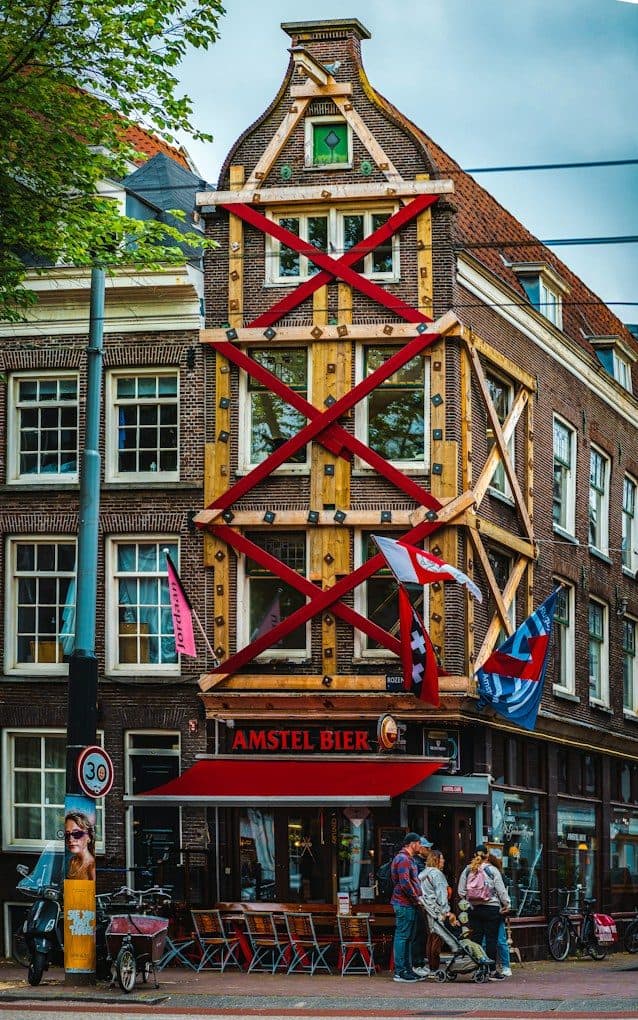 A tall building with a wooden structure on top of it